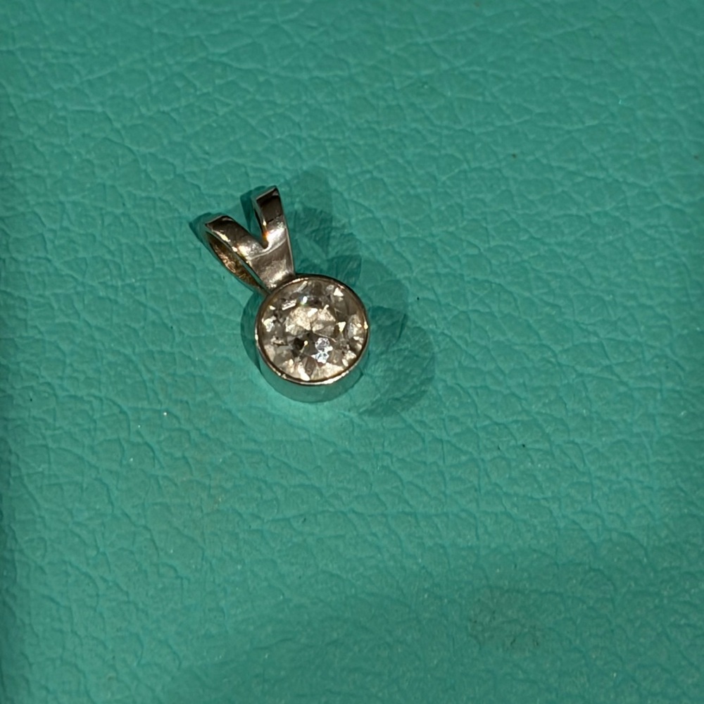 Diamond pendant.  1/3 karat bezel set diamond.  appraisal included.